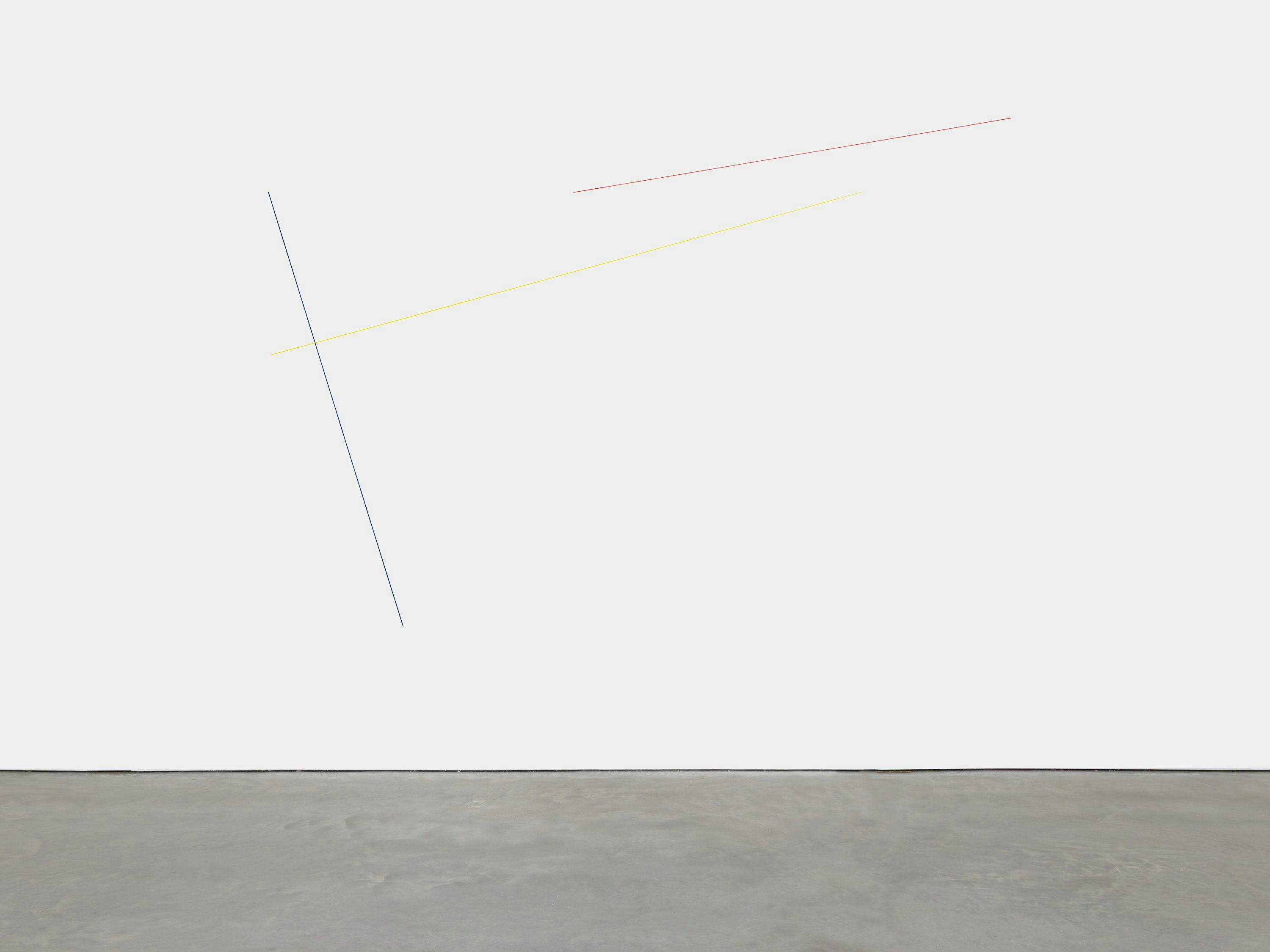 A blue, yellow, and red acrylic yarn artwork by Fred Sandback, titled Untitled (Sculptural Study, Three-part Wall Construction), 1985 and 2018.